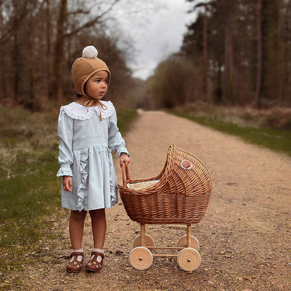 Tall wicker doll pram in natural color with berry bedding 